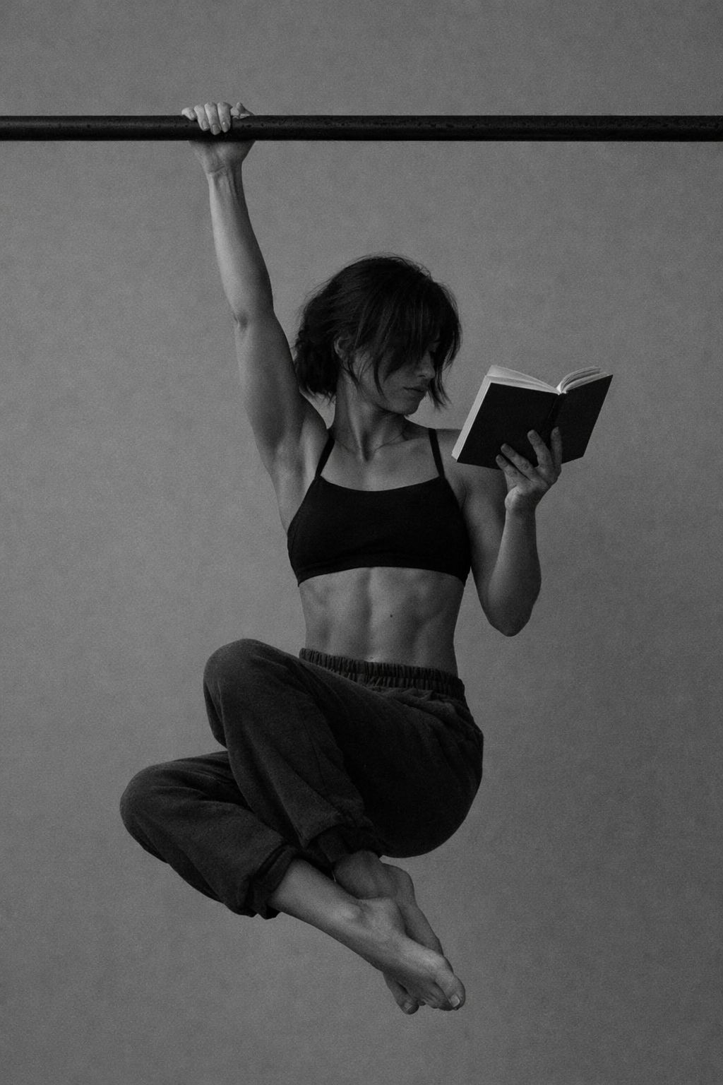 Person planning a healthy weekly routine on a notebook